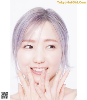 a magazine page with a picture of a woman with purple hair