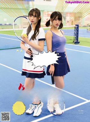 A woman in a blue top and skirt playing tennis.
