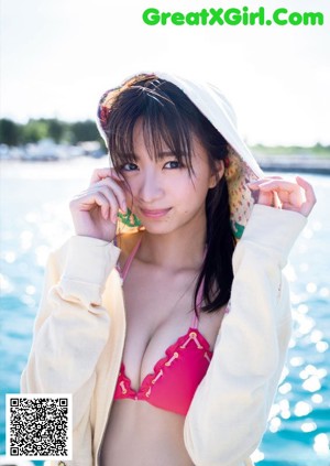A woman in a bikini on the cover of a magazine.